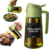 Glass oil bottle being refilled with olive oil