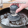 Soap dispensing brush cleaning a pot