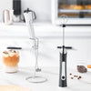 Handheld electric frother for milk foam